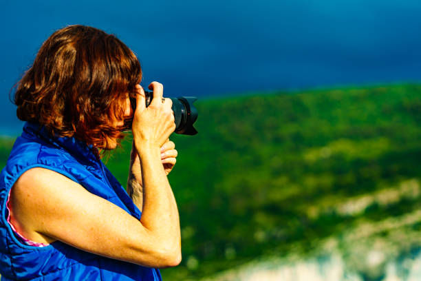 istock Woman take photo on mountain nature. 1775277783