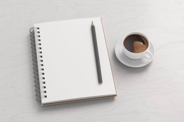 istock Notebook mockup. Blank notebook, coffee and pencil. Spiral notepad on white wooden desk 1775283701