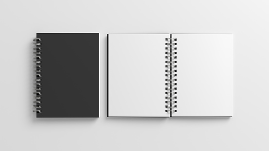 Notebook mockup. Closed and open blank notebook with black cover. Spiral notepad on white background. 3d illustration