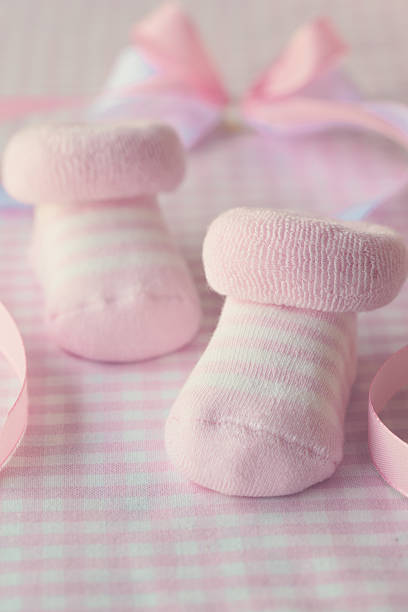 Baby's legs close up on a light blanket. Place for text. The concept of children's health, safety, love