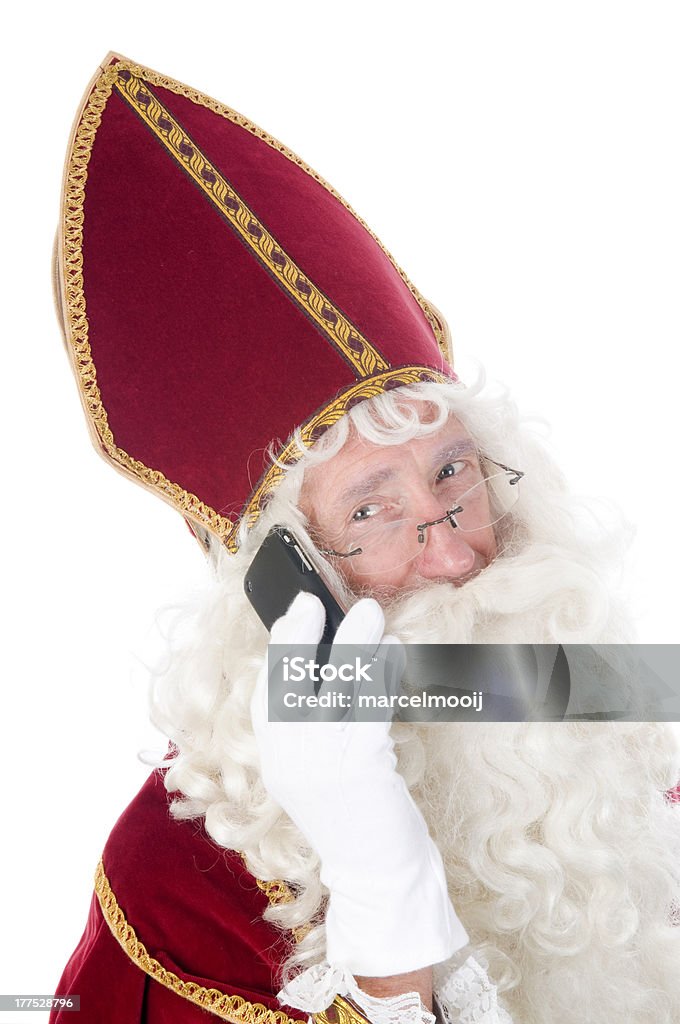 Sinterklaas con un telefono cellulare - Foto stock royalty-free di Babbo Natale