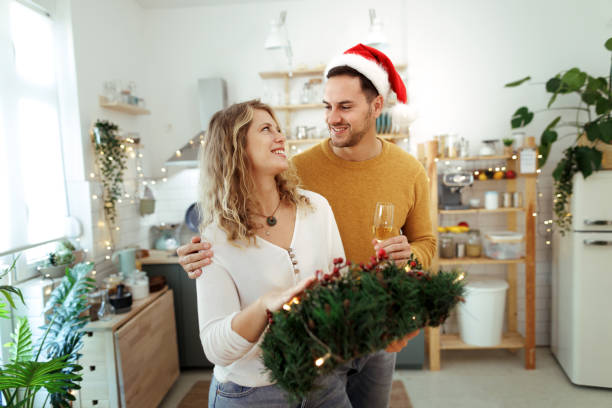istock Young smiling couple bonding at home during Christmas eve 1775291762