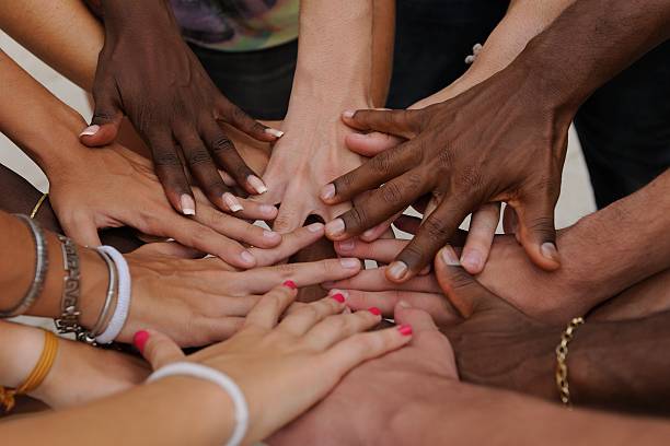 Diverse human hands showing unity Diverse human hands showing unity group therapy photos stock pictures, royalty-free photos & images