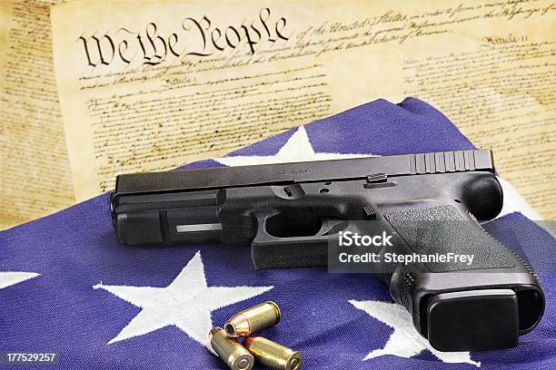 Handgun And Constitution Stock Photo - Download Image Now - American Flag, Gun, Handgun