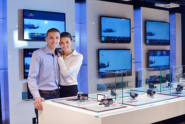 istock couple in consumer electronics store buying photo camera 177529376