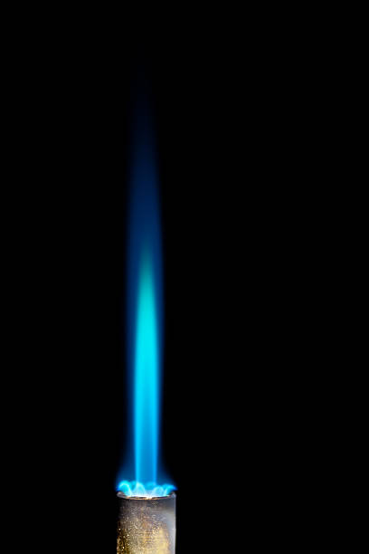 Natural gas flame against black background Industrial natural gas burner isolated on black background welding torch stock pictures, royalty-free photos & images