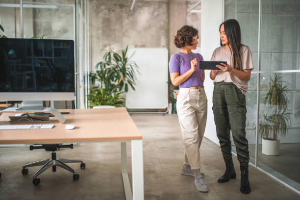 istock Two Females Exploring Digital Trends Together in a Modern Office 1775296664