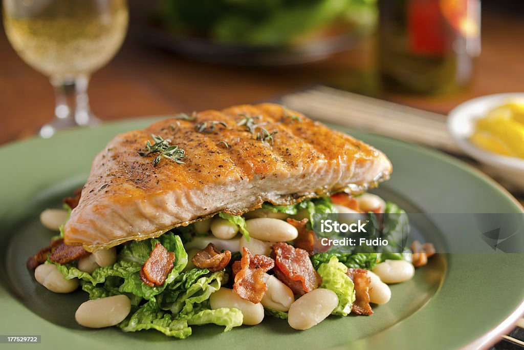 Grilled Salmon with Cannellini "Grilled salmon with white beans, bacon, and kale." Cannellini Bean Stock Photo