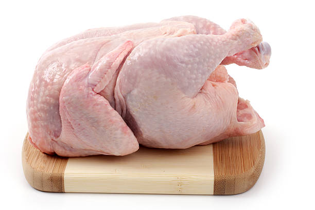 istock raw chicken on wooden board 177529797