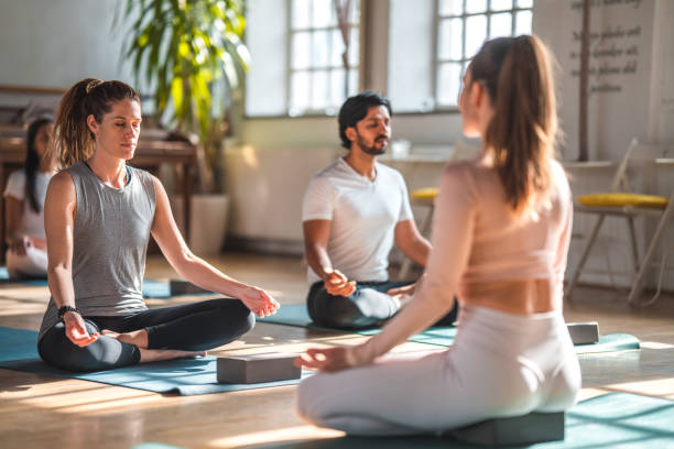 istock Attractive Caucasian Yoga Student With Ponytail With  Group 1775304292