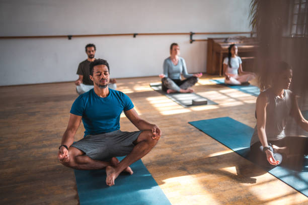 istock South-American Man and Multiracial Mixed Group  Meditating Together Indoors 1775304299