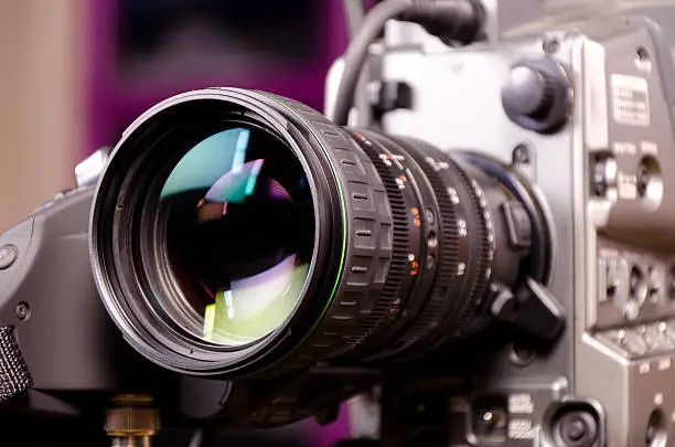 Close view of professional video camera lens