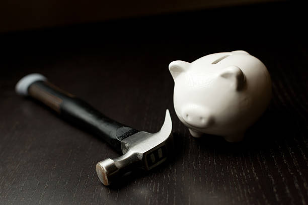 Piggy savings bank and hammer. stock photo