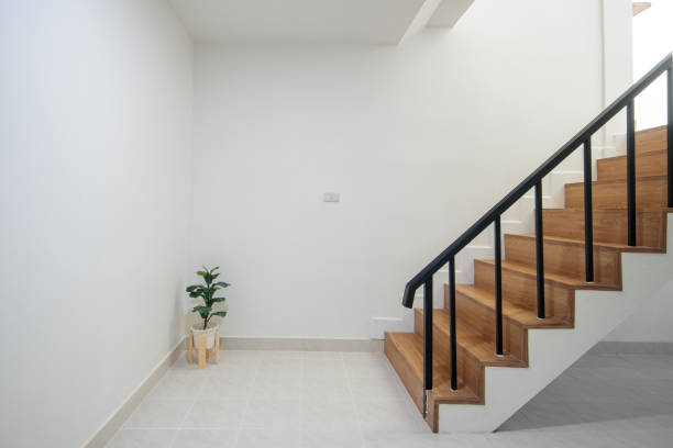 istock Wood staircase inside contemporary white modern house interior. 1775313960