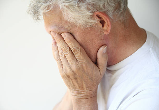 istock older man overcome with depression or emotions 177531784