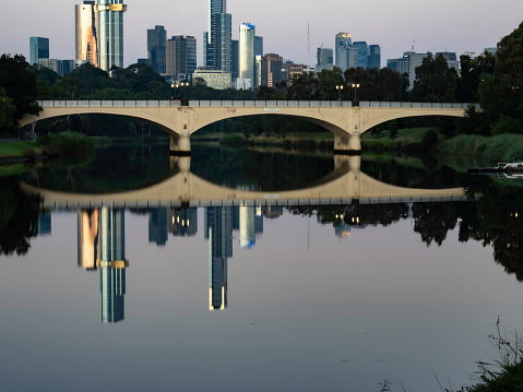 Melbourne skyline next to the Yarra River at sunrise