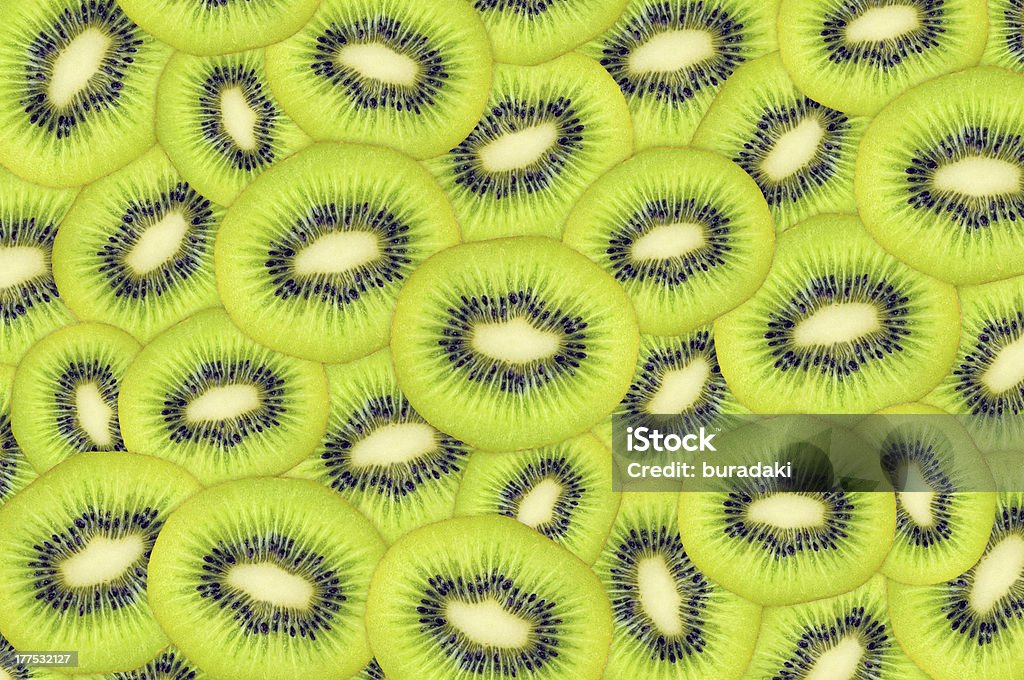 Kiwi background Background from slices of fresh kiwi fruit Backgrounds Stock Photo