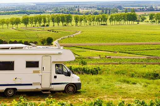 Camper rv visiting vineyard region. Pommard in Burgundy, Cote de Beaune, Cote d'Or, France. Summer holidays, trip attraction with mobile home.