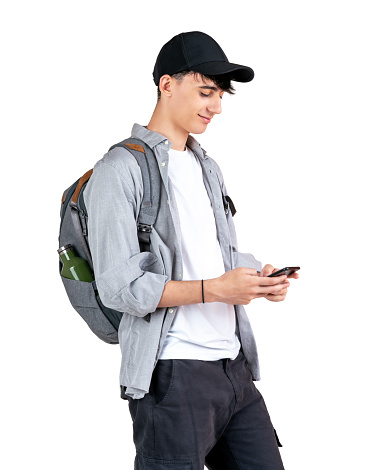 Student teenager texting standing, isolated on white background.
