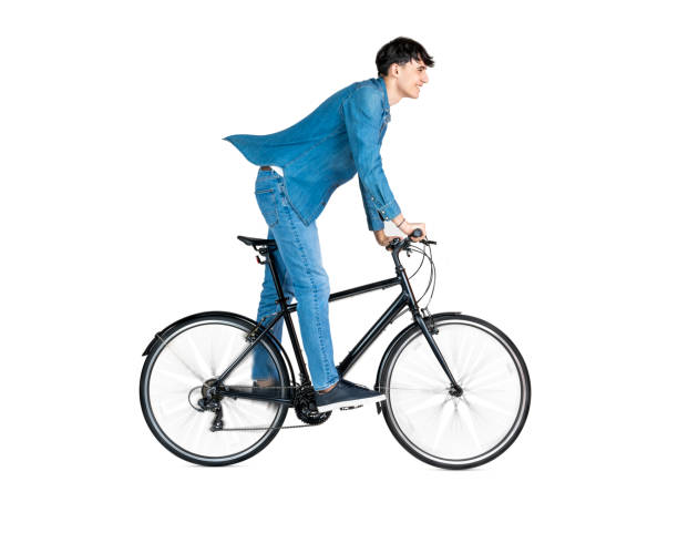 Young adult riding a bicycle isolated on white background. Wheels in motion.