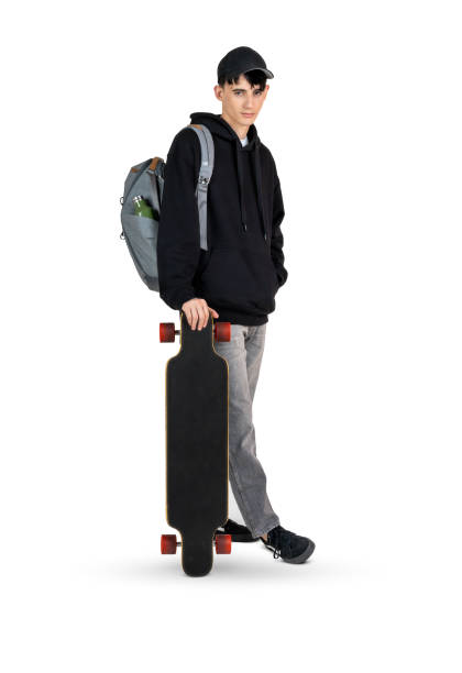 Student Teenager with backpack and longboard looking at camera isolated on white background.