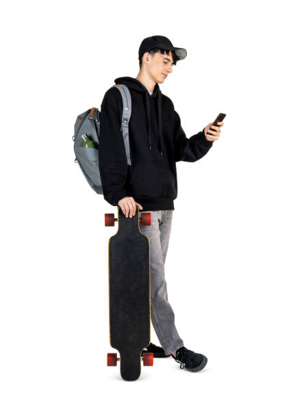 Teenager texting on his phone stock photo