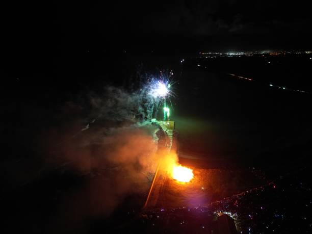 Fireworks Over Rosehearty Fireworks over the coastal town of Rosehearty in Aberdeenshire, Scotland. beach fire scotland stock pictures, royalty-free photos & images