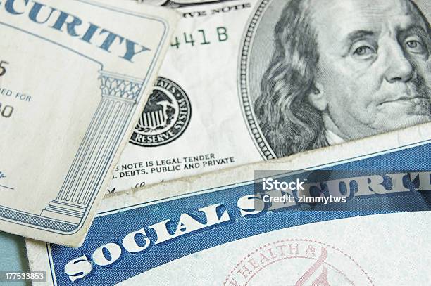 Social Security Cards Angled On Top One Hundred Dollar Bill Stock Photo - Download Image Now