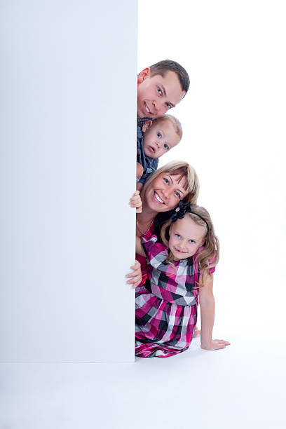 istock Smiling family peek out 177534360