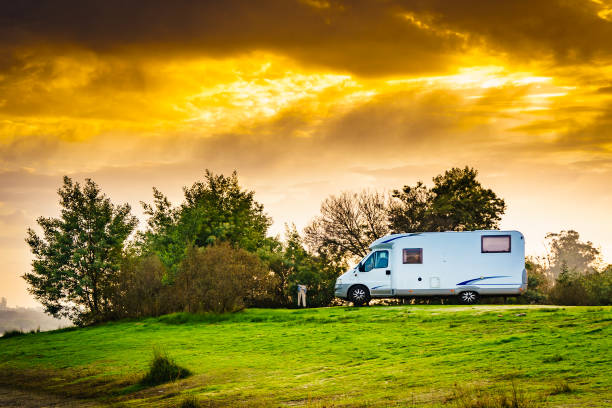 istock Rv caravan on lake shore at sunset. Autumn time. 1775353209