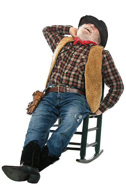 istock Laughing old cowboy leans back in rocking chair 177535744