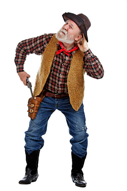 istock Old cowboy draws his gun and listens 177535763