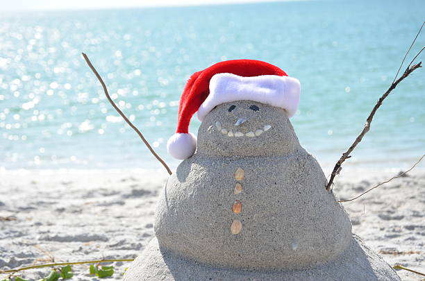 Florida Snowman A snowman made out of sand on the beach of Little Gasparilla Island, Florida. florida christmas stock pictures, royalty-free photos & images