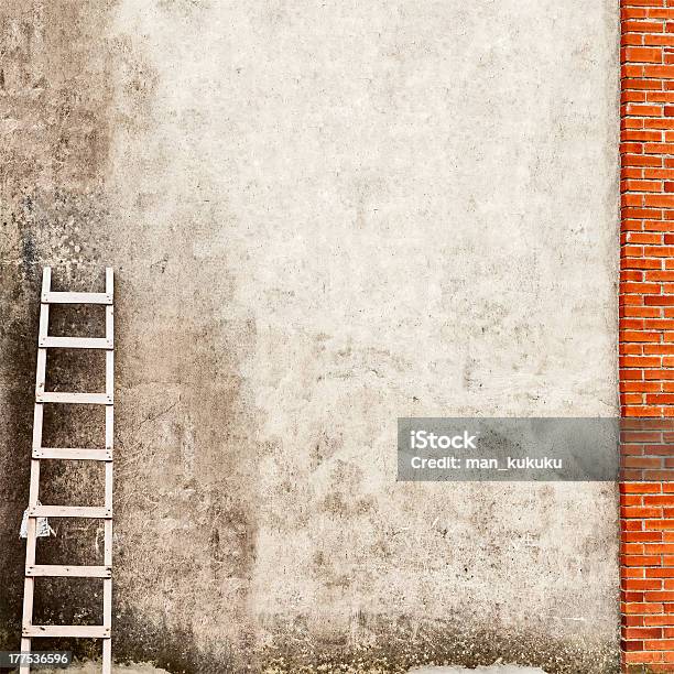 Weathered Concrete Wall Connecting To A Red Brick Wall Stock Photo - Download Image Now