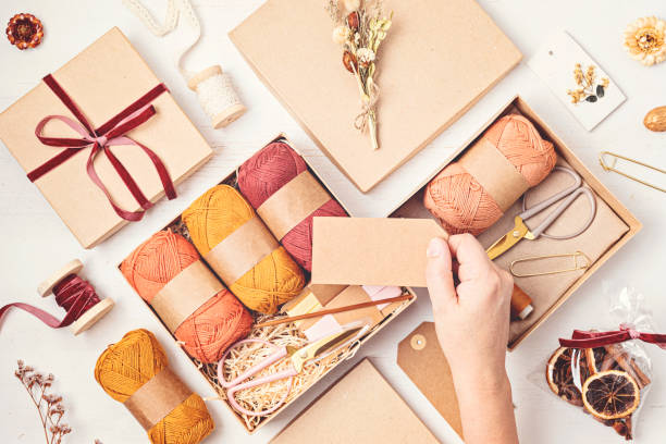 istock Preparing gift box for knitting lovers. Plastic free zero waste care package. Personalized eco friendly basket for family and friends for autumn holidays, christmas, mothers day 1775371263