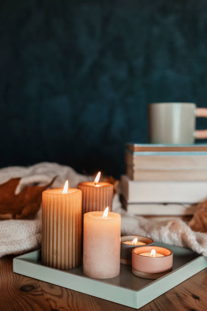 istock Composition with a stack of books, hot beverage in the mug and warm blanket. Cozy reading scene for cold weather with cup of coffee 1775371264