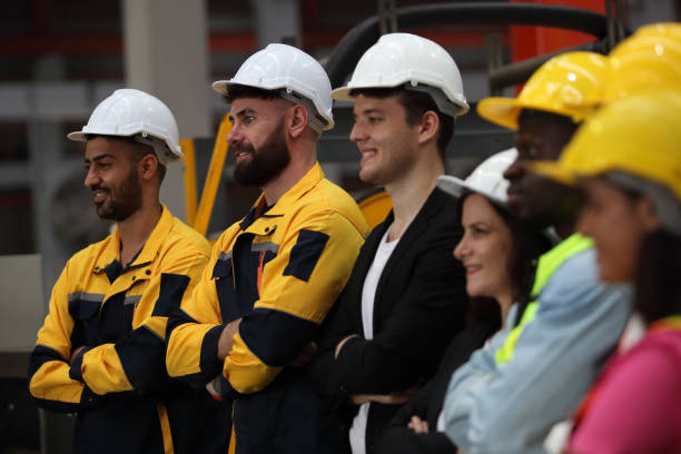 istock engineer team or worker team  with safety uniform standing at industry. 1775372060
