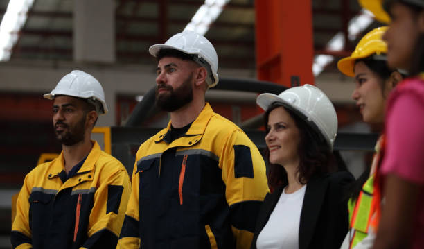 istock engineer team or worker team  with safety uniform standing at industry. 1775372067