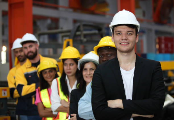 istock engineer team or worker team  with safety uniform standing at industry. 1775372075
