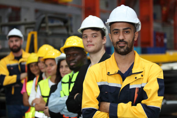 istock engineer team or worker team  with safety uniform standing at industry. 1775372076