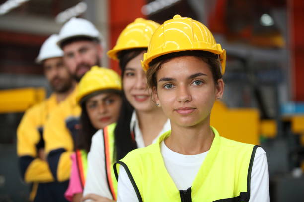 istock engineer team or worker team  with safety uniform standing at industry. 1775372107