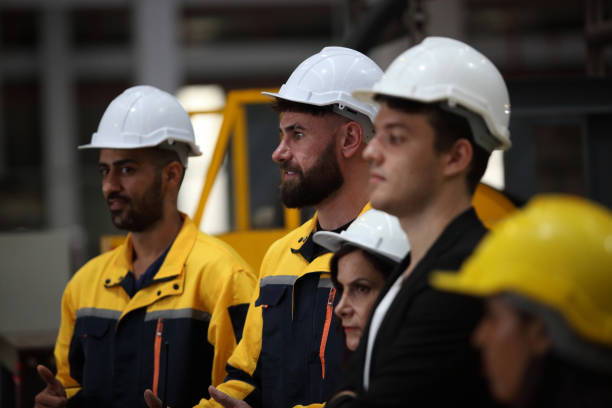 istock engineer team or worker team  with safety uniform standing at industry. 1775372117