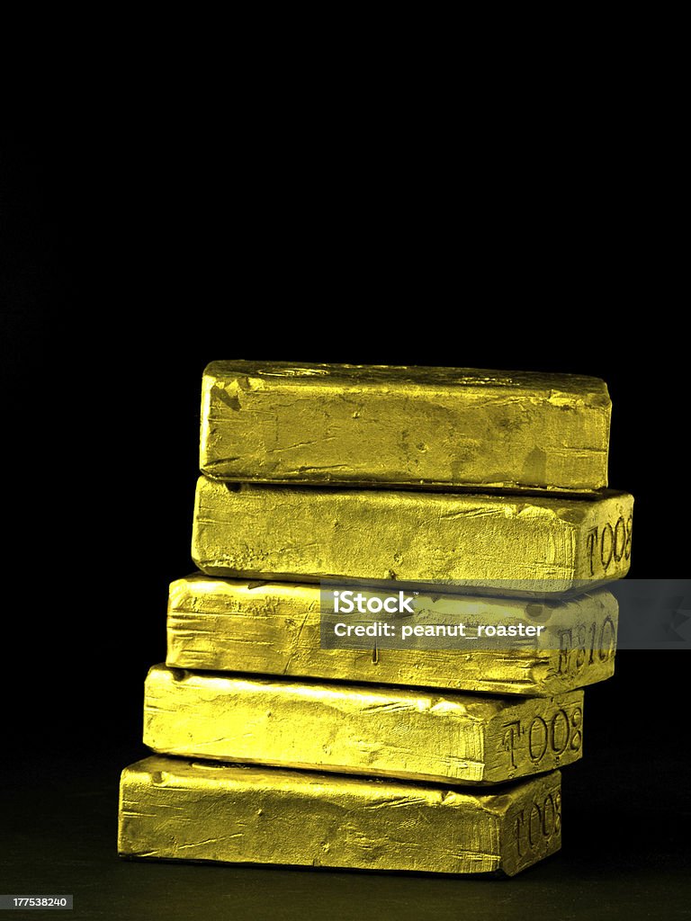 Stack of Gold Bars over black Five shiny gold bricks stacked with a plain black background. Bank - Financial Building Stock Photo