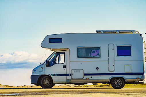 Caravan rv above clouds. Motor home camping car in mountain nature in Portugal. Adventure with camper vehicle.