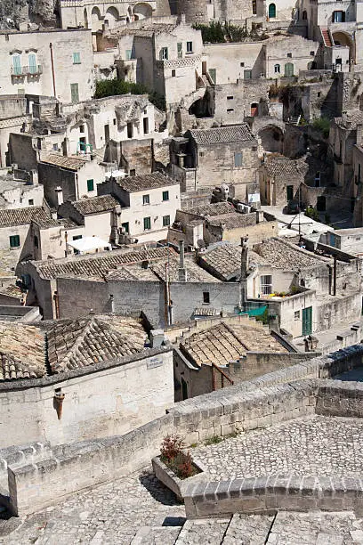 "Cityscape detail of Sassi di Matera, toward sasso Barisano, during a summer sunny day."