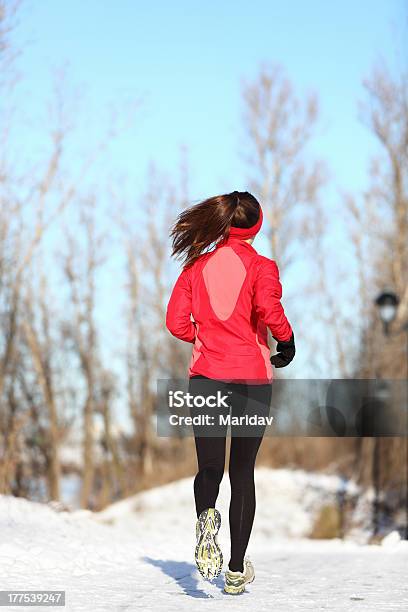 Winter Running Woman In Snow Stock Photo - Download Image Now - One Woman Only, Women, 20-29 Years