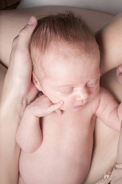istock Small baby sleeping on mother`s hand 177539306