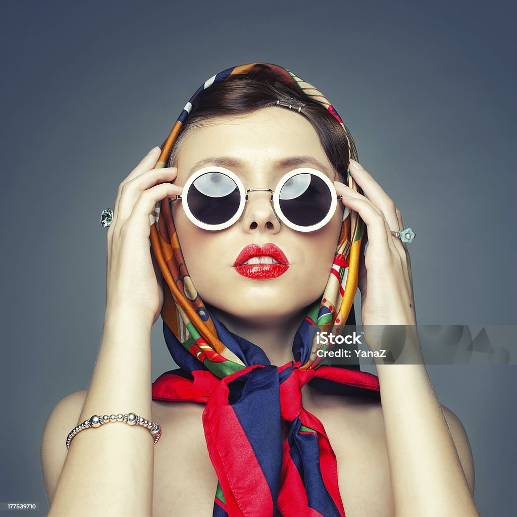 Portrait of a girl with glasses The square image of a girl in retro handkerchief Women Stock Photo