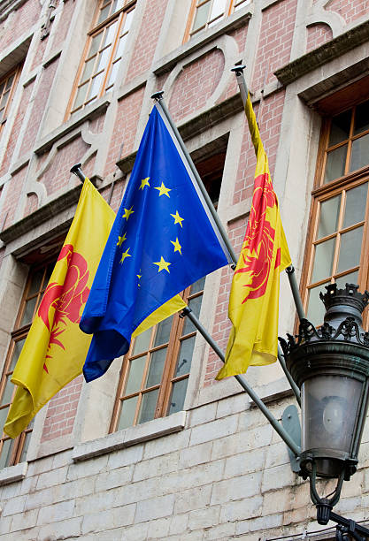 Official flags of Wallonia region of Belgium and Europe in Brussels.