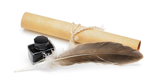 istock feather pen, ink,rolls of old yellowed paper 177540367